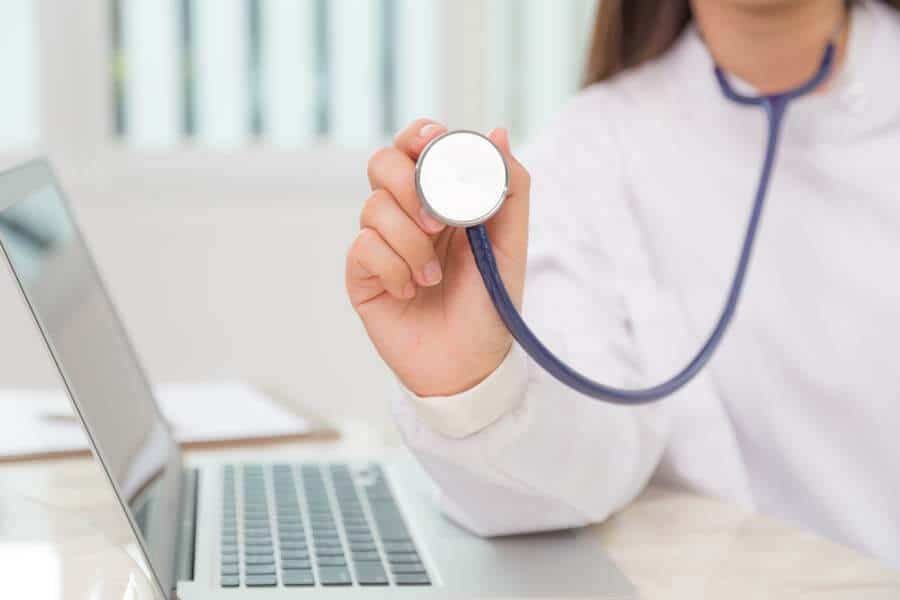 Biomedical engineer supporting laboratory equipment